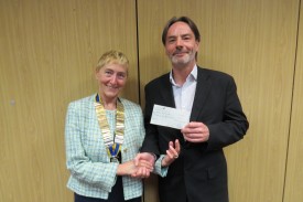 President Jackie presents a cheque to Aiden Knox of Warwick CAB